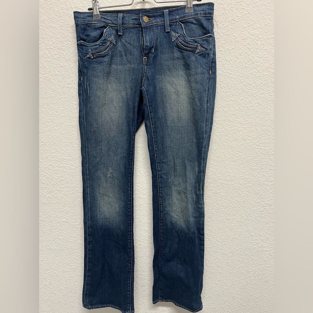 Vintage low-rise western inspired distressed bootcut jeans